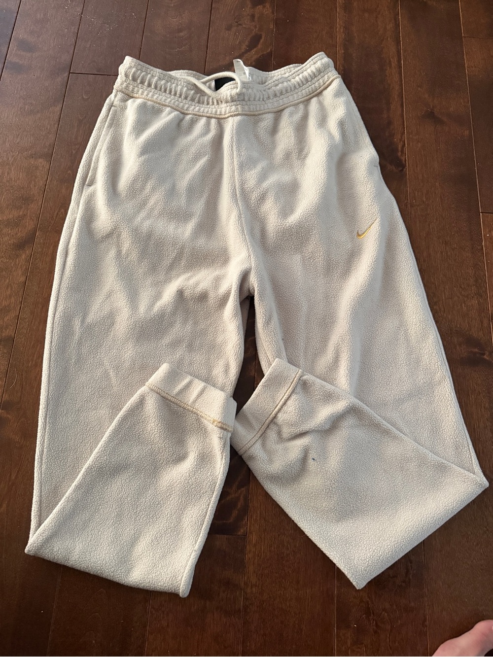 Nike Woman’s size Med Cream Sweatpants with Gold Swoosh Accent